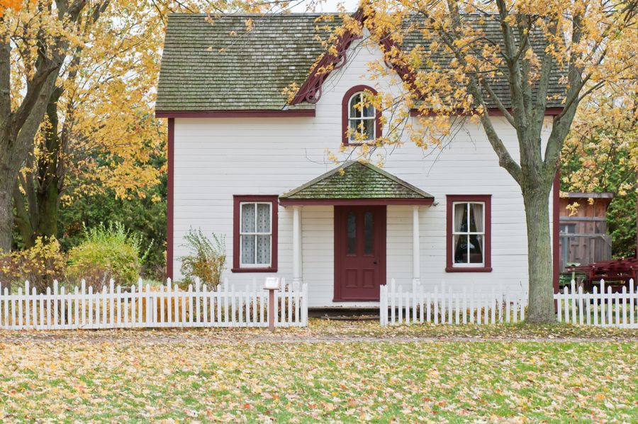 Two-story home with manicured front yard